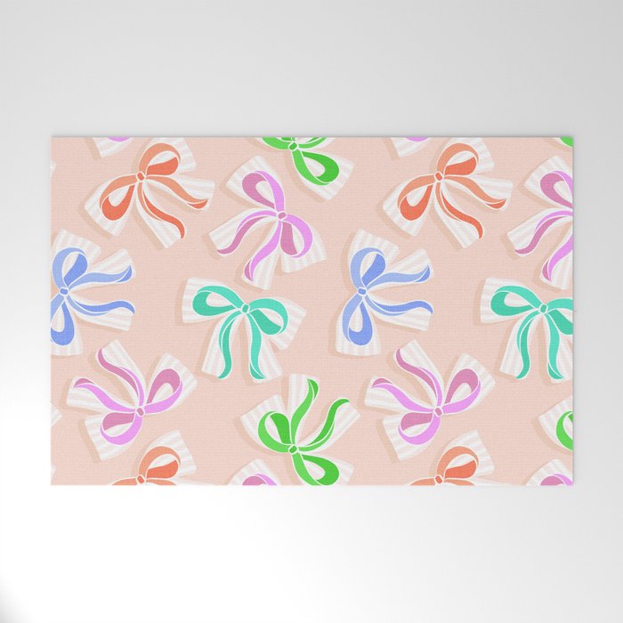 Ditsy Kitsch Ribbons and bows 1. Pastel Rainbow colours on Peach Welcome Mat Gallery Image 1