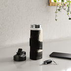 Abstract Minimalist Painted Brushstrokes in Black and Almond Cream 1 Water Bottle Gallery Image 4