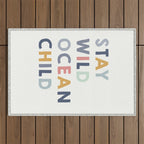 Stay Wild Ocean Child quote, perfect for an ocean theme nursery Outdoor Rug Gallery Image 1