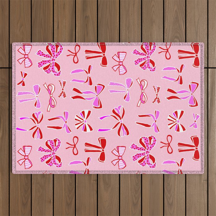Festive Pink and Red Christmas Ribbons and Bows hand drawn Collection on Pastel Pink Outdoor Rug Gallery Image 1