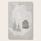 a wooden house in a snowy forest Cutting Board Gallery Image 1