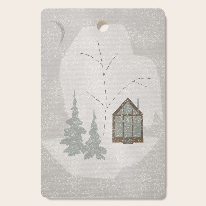 a wooden house in a snowy forest Cutting Board Gallery Image 1