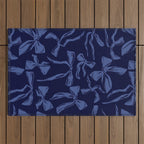 Blue bow pattern with dark background Outdoor Rug Gallery Image 1