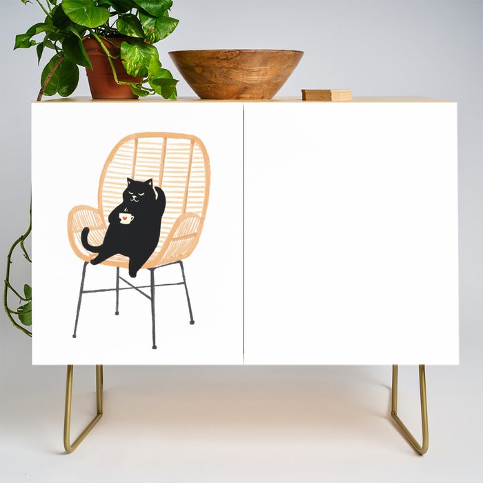 Lazy cat 2 enjoying coffee on rattan chair  Credenza Gallery Image 1