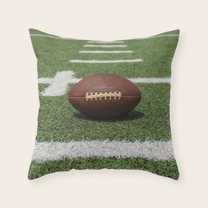 American Football Court with ball on Gras Throw Pillow Gallery Image 1