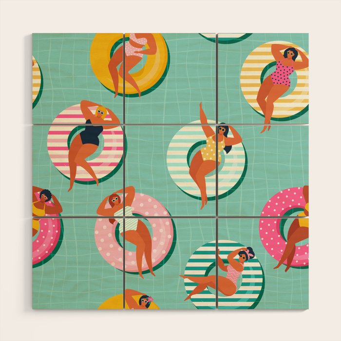 Summer gils on inflatable in swimming pool floats. Wood Wall Art Gallery Image 1
