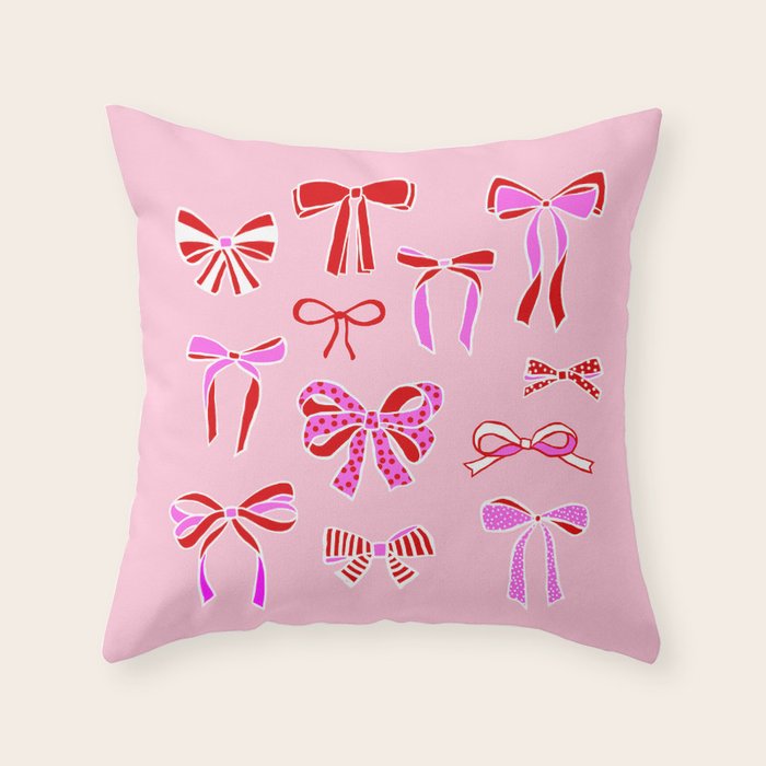 Festive Pink and Red Christmas Ribbons and Bows hand drawn Collection on Pastel Pink Throw Pillow Gallery Image 1