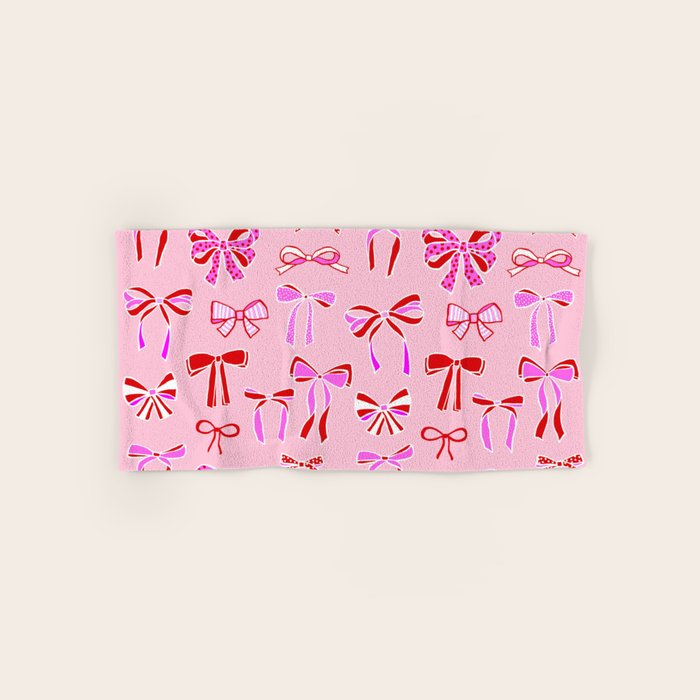 Festive Pink and Red Christmas Ribbons and Bows hand drawn Collection on Pastel Pink Bath Towel Gallery Image 1