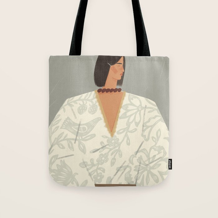  portrait of a fragile woman in a white embroidered shirt on a blue background Tote Bag Gallery Image 1