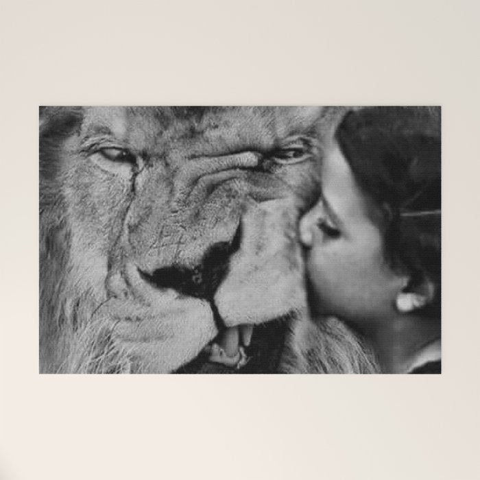 Grouchy Lion being kissed by brunette girl black and white photography Welcome Mat Gallery Image 1