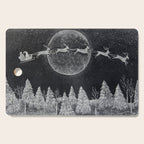 Santa flying over a winter wonderland of snow covered trees in his reindeer drawn sleigh by the light of a full moon Cutting Board Gallery Image 1