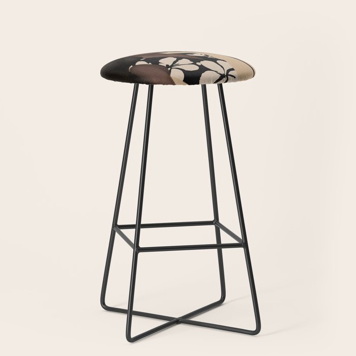 Woman in Bold Print with Black Horse Stool Gallery Image 1