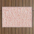 faces (pink) Outdoor Rug Gallery Image 1