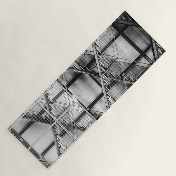 Escape from New York fire escape symmetrical steel staircase architecture black and white photograph Yoga Mat Gallery Image 1