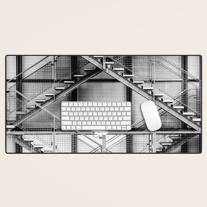 Escape from New York fire escape symmetrical steel staircase architecture black and white photograph Desk Mat Gallery Image 1
