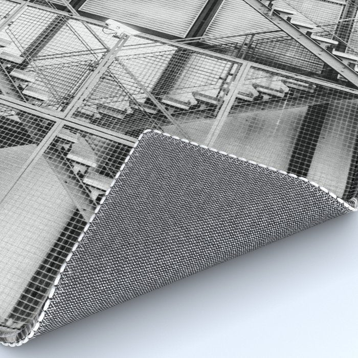 Escape from New York fire escape symmetrical steel staircase architecture black and white photograph Rug Gallery Image 4