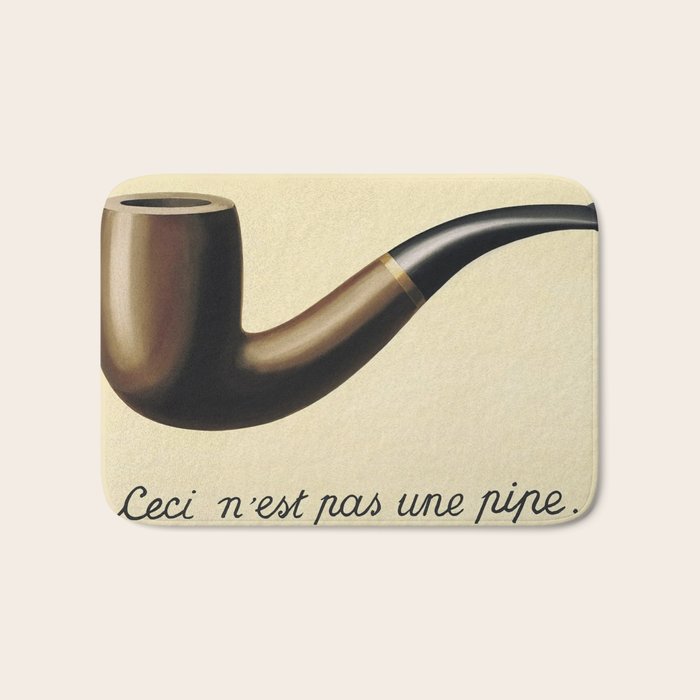 The Treachery of Images (This is not a pipe) by Rene Magritte Bath Mat Gallery Image 1