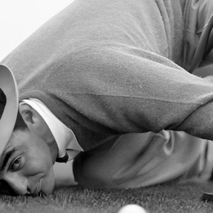 Eye to the ground on the 18th hole; golfing man eyes ball to measure distance to hole vintage black and white portrait photograph - photography - photographs poster Coffee Mug Gallery Image 2
