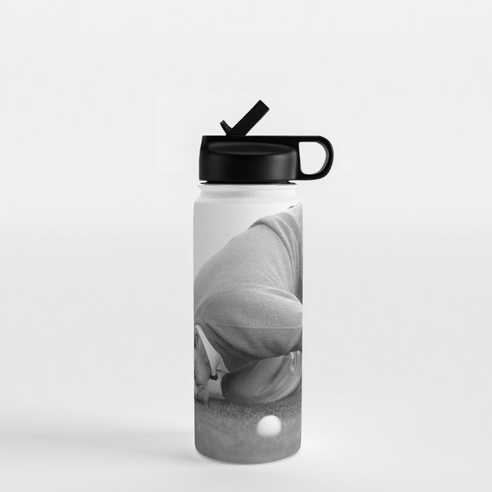 Eye to the ground on the 18th hole; golfing man eyes ball to measure distance to hole vintage black and white portrait photograph - photography - photographs poster Water Bottle Gallery Image 1