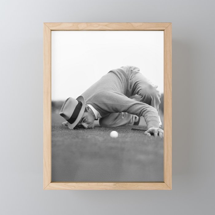Eye to the ground on the 18th hole; golfing man eyes ball to measure distance to hole vintage black and white portrait photograph - photography - photographs poster Mini Art Print Gallery Image 1