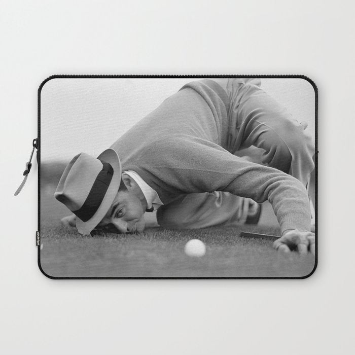 Eye to the ground on the 18th hole; golfing man eyes ball to measure distance to hole vintage black and white portrait photograph - photography - photographs poster Laptop Sleeve Gallery Image 1