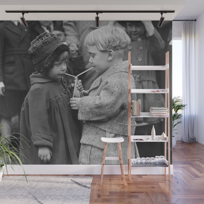 Sweet little boy and girl sharing a drink vintage funny humorous black and white photograph Wall Mural Gallery Image 1
