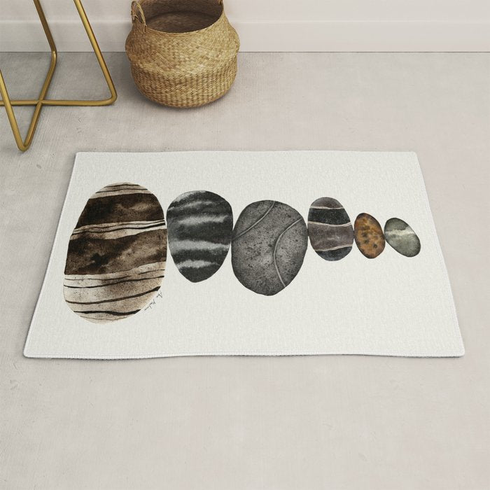 balancing beach pebbles Rug Gallery Image 1