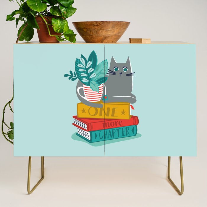 One more chapter // aqua background grey cat striped mug with plants red green and yellow books  Credenza Gallery Image 1