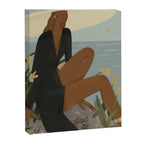 a woman in a black dress on the seashore Canvas Print Gallery Image 6