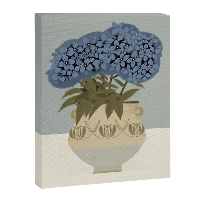 bouquet of lush blue hydrangeas in a vase on a blue background Canvas Print Gallery Image 1
