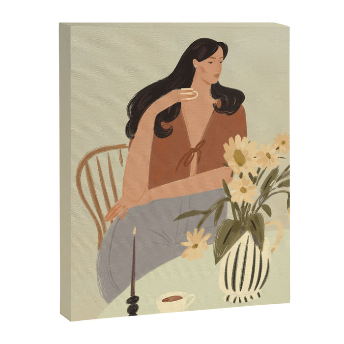 portrait of a fragile woman at a table with flowers Canvas Print Gallery Image 1