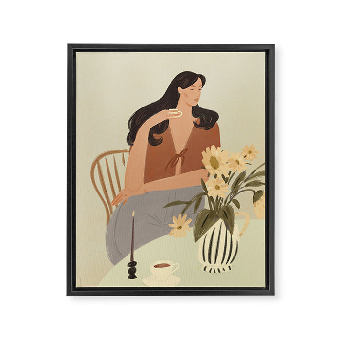portrait of a fragile woman at a table with flowers Framed Canvas Print Gallery Image 1
