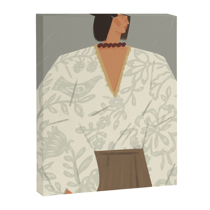  portrait of a fragile woman in a white embroidered shirt on a blue background Canvas Print Gallery Image 1