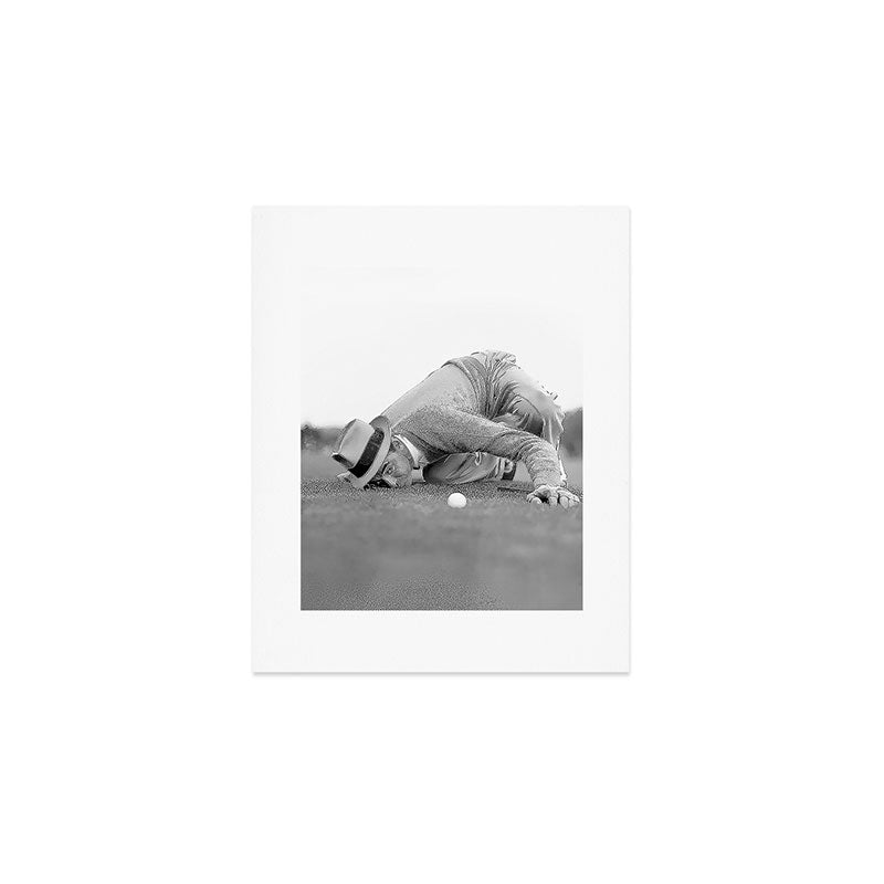 Eye to the ground on the 18th hole; golfing man eyes ball to measure distance to hole vintage black and white portrait photograph - photography - photographs poster Art Print Gallery Image 1