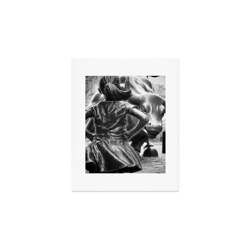Fearless Girl facing down the Charging Bull statue of Wall Street black and white photography Art Print Gallery Image 1