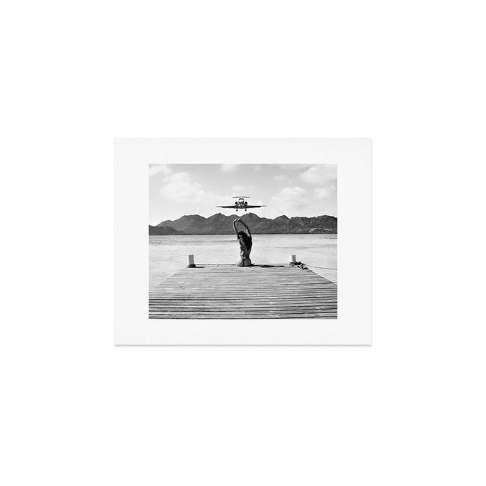 Steady as she goes girl in bikini on a dock with plane landing black and white photograph Art Print Gallery Image 1