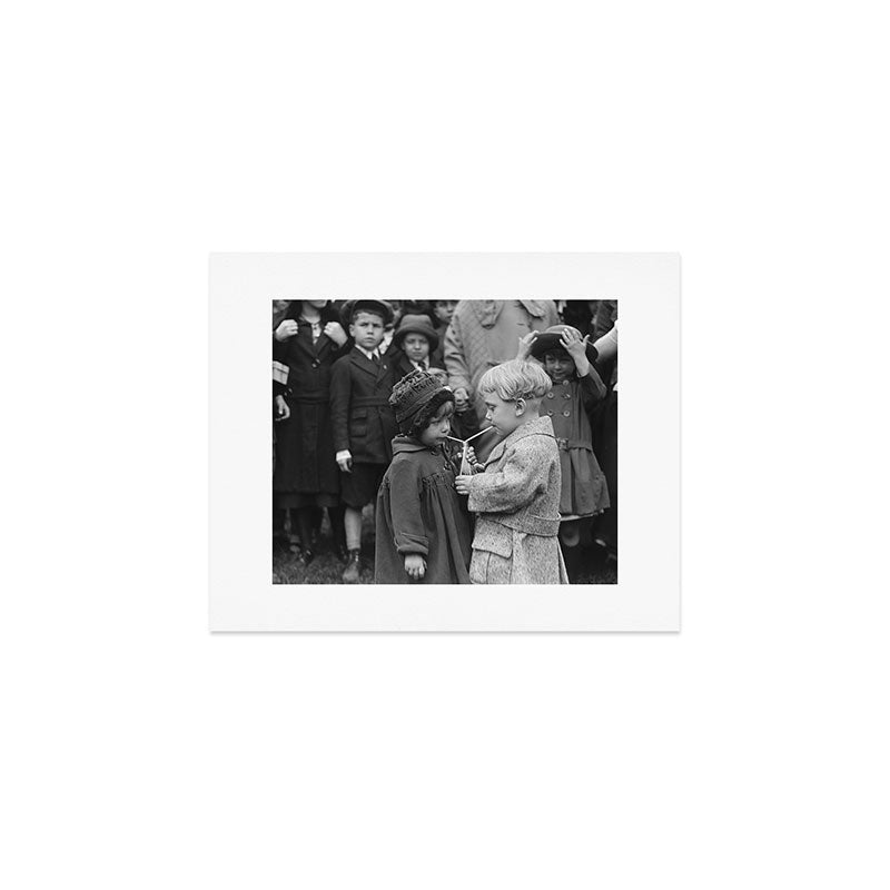 Sweet little boy and girl sharing a drink vintage funny humorous black and white photograph Art Print Gallery Image 1