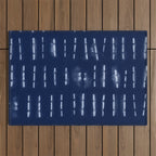 White stripes over blue shibori tie dye pattern Outdoor Rug Gallery Image 1