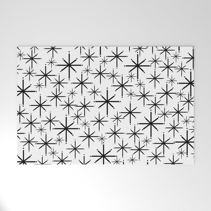 Mid Century Modern Twinkling Starburst Pattern in Black and White Welcome Mat Gallery Image 1