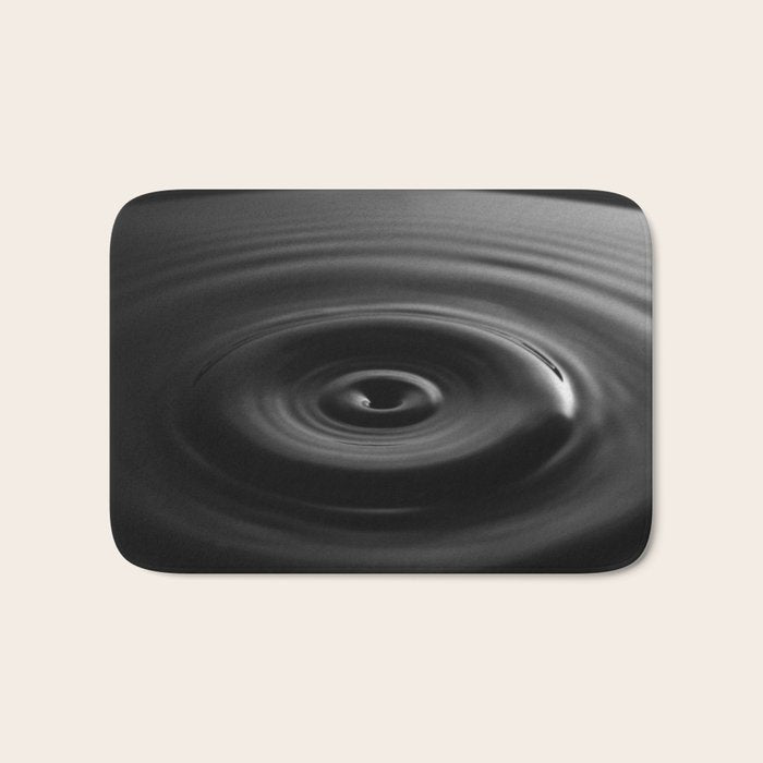 Zen water droplet in pool of water black and white inspirational photograph art print Bath Mat Gallery Image 1