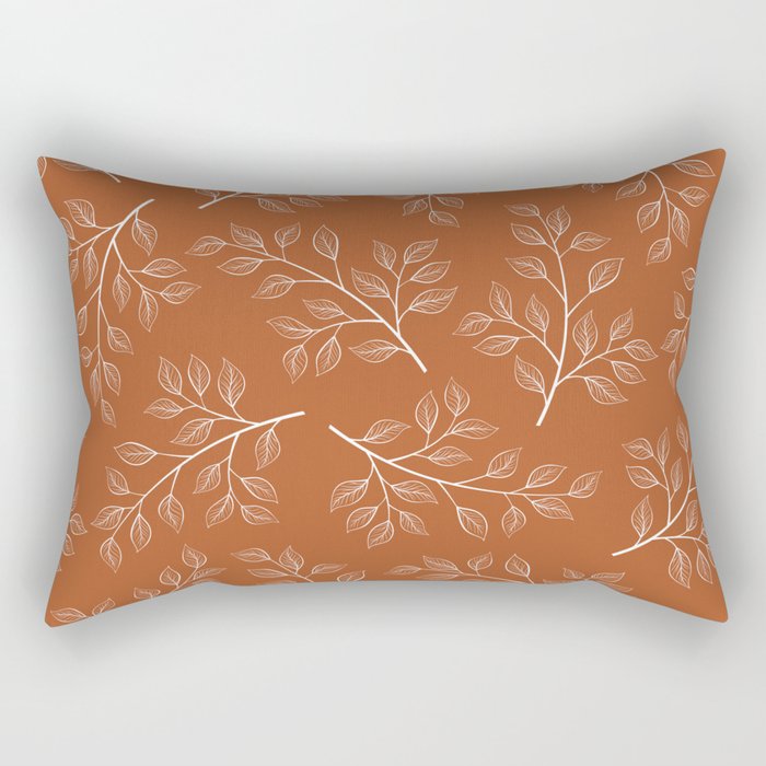 Delicate White Leaves and Branch on a Rust Orange Background Rectangular Pillow Gallery Image 1
