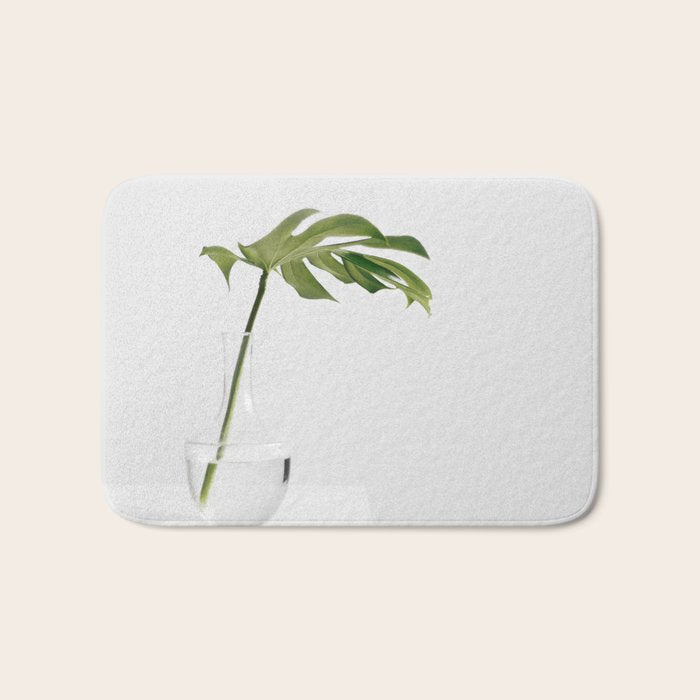 Single Monstera Leaf In Clear Glass Zen Minimalist House Plant Photo Bath Mat Gallery Image 1