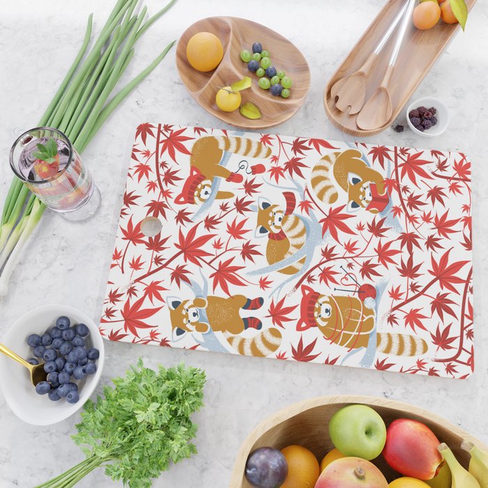 Red panda blending with the foliage // white background desert sun brown cozy animals fog blue tree branches red acer leaves Cutting Board Gallery Image 2