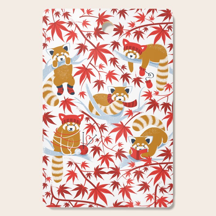 Red panda blending with the foliage // white background desert sun brown cozy animals fog blue tree branches red acer leaves Cutting Board Gallery Image 1