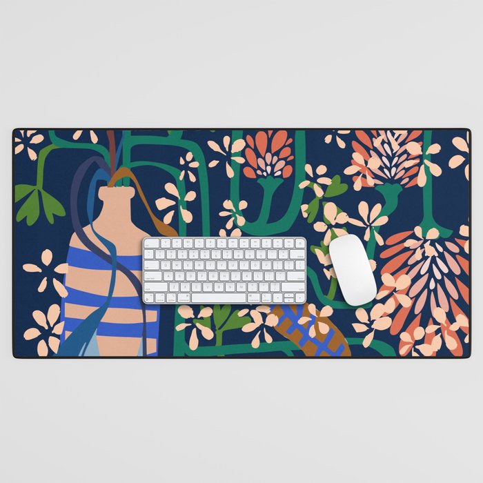Strainge Clover blossoms in a vase dark blue Desk Mat Gallery Image 1
