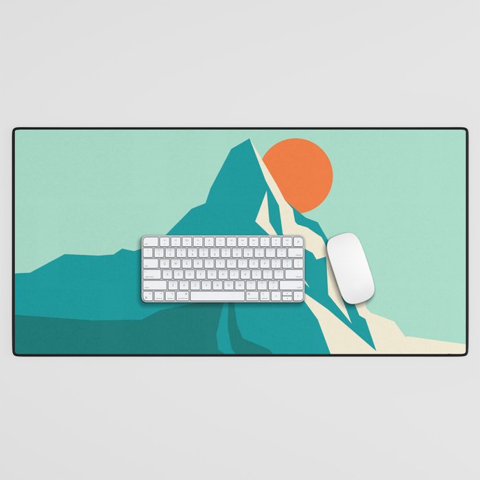 As the sun rises over the peak Desk Mat Gallery Image 1