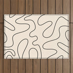 Squiggle Abstract Minimalist Modern Pattern in Black and Almond Cream Outdoor Rug Gallery Image 1