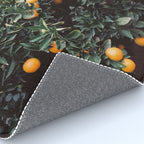 Oranges | Moody colorful travel photography | Botanical green wall with oranges Rug Gallery Image 4