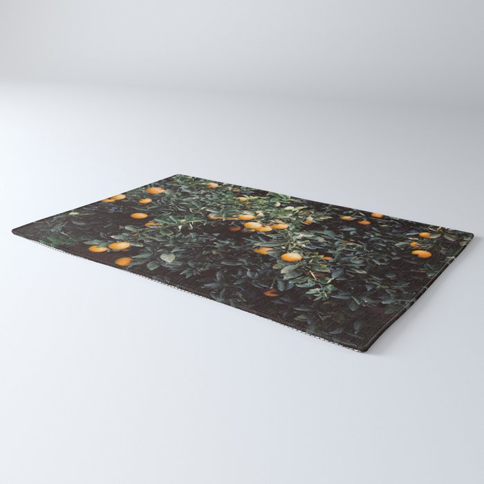 Oranges | Moody colorful travel photography | Botanical green wall with oranges Rug Gallery Image 3