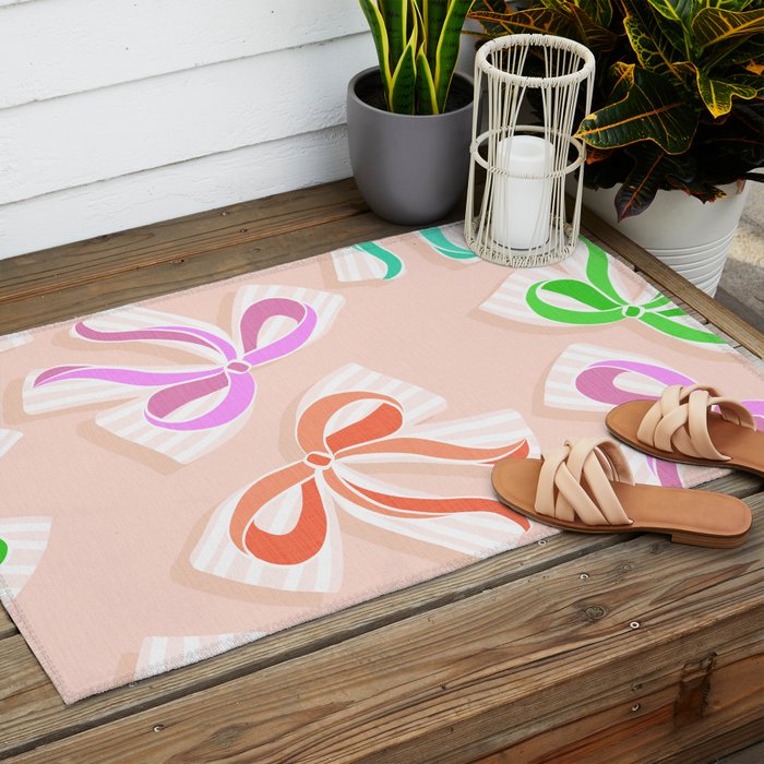Ditsy Kitsch Ribbons and bows 1. Pastel Rainbow colours on Peach Outdoor Rug Gallery Image 2